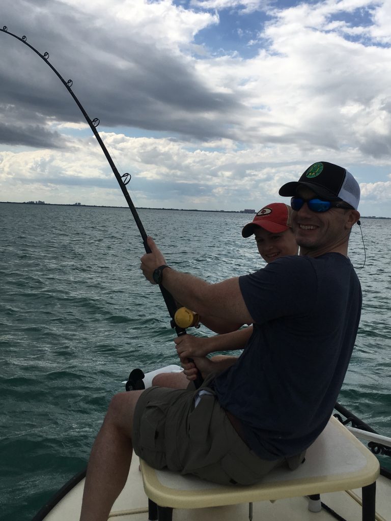 Mike and his son catch a hammerhead shark